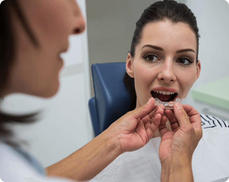 Dentist Assisting Patient Wear Invisible Braces